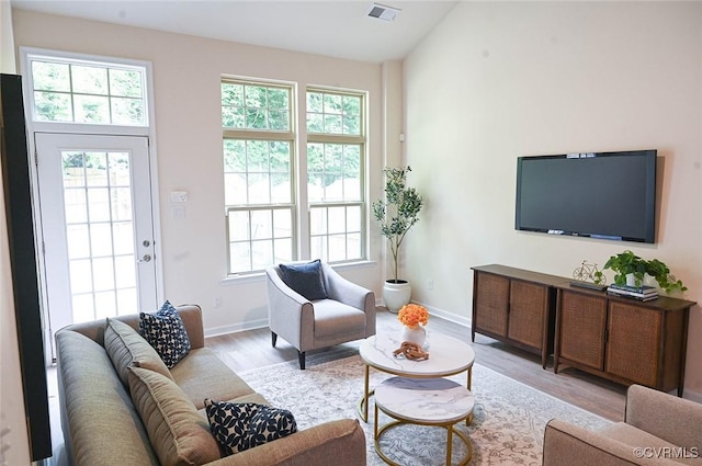 5801 Riverside Trl, Richmond, VA 23225 - living area featuring wood finished floors, baseboards, and vaulted ceiling