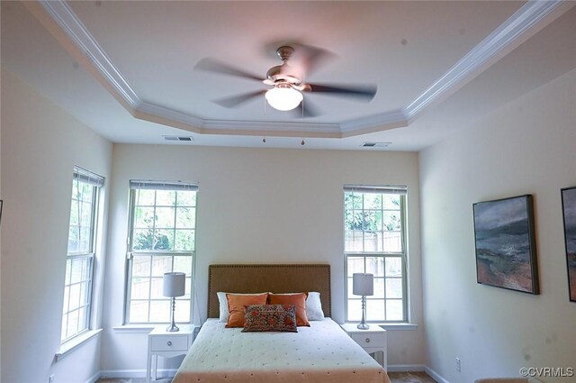 5801 Riverside Trl, Richmond, VA 23225 - bedroom featuring ornamental molding, a tray ceiling, baseboards, and a ceiling fan
