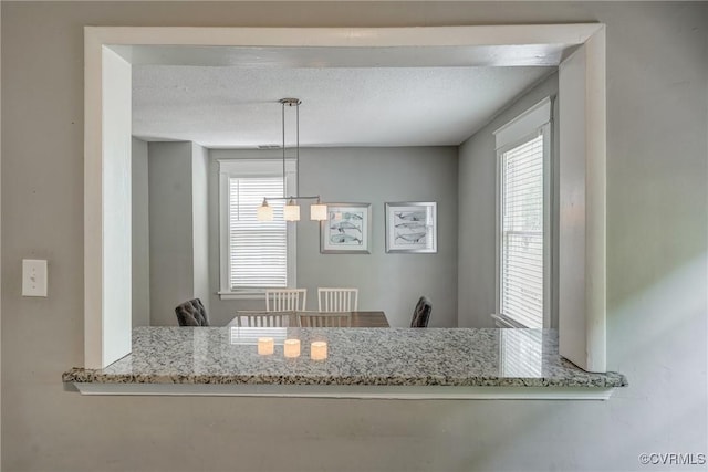 dining area with a textured ceiling