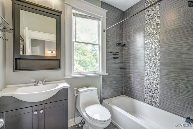 full bathroom featuring plenty of natural light, toilet, shower / bathtub combination, and vanity