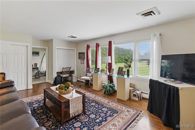 12060 Pinhook Rd, Hanover, VA 23146 - living room featuring plenty of natural light, wood finished floors, and baseboard heating