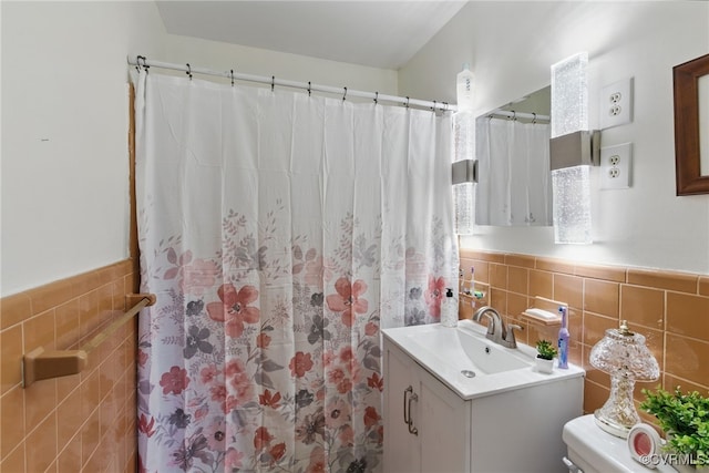 12060 Pinhook Rd, Hanover, VA 23146 - full bathroom with tile walls, vanity, a wainscoted wall, a shower with shower curtain, and toilet