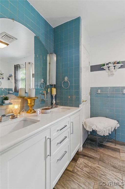 12060 Pinhook Rd, Hanover, VA 23146 - bathroom with tile walls, double vanity, and wood finished floors