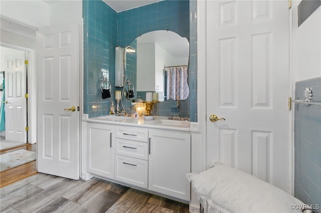 12060 Pinhook Rd, Hanover, VA 23146 - bathroom featuring double vanity, tile walls, and wood finished floors