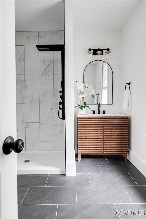 1517 Oakwood Ave, Richmond, VA 23223 - full bath featuring vanity, tiled shower, and baseboards