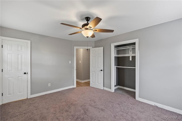 unfurnished bedroom featuring carpet, baseboards, ceiling fan, and a closet