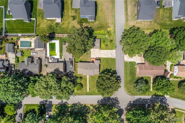 aerial view of property and surrounding area featuring nearby suburban area