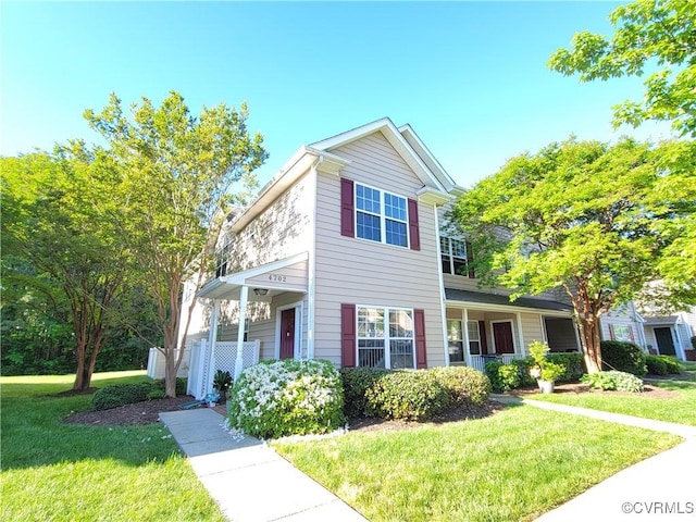 traditional-style home with a front yard