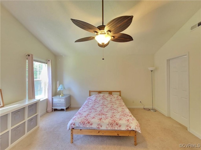 bedroom with light carpet, baseboards, lofted ceiling, and a ceiling fan