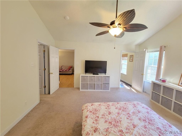 bedroom with lofted ceiling, carpet, baseboards, and ceiling fan