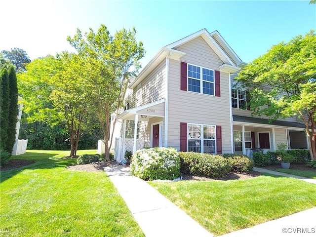 view of front of property with a front lawn and a porch