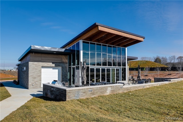 view of home's exterior featuring a lawn and an attached garage
