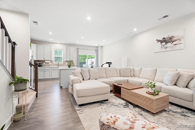 11301 Winding Brook Terrace Dr, Hanover, VA 23005 - living room with light wood-type flooring, recessed lighting, and stairs