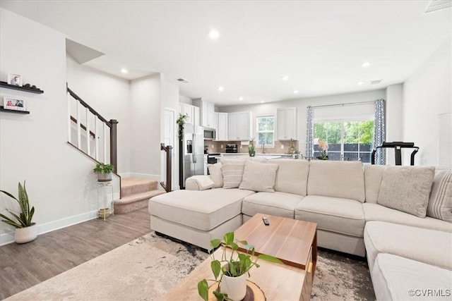 11301 Winding Brook Terrace Dr, Hanover, VA 23005 - living room with stairway, recessed lighting, wood finished floors, and baseboards