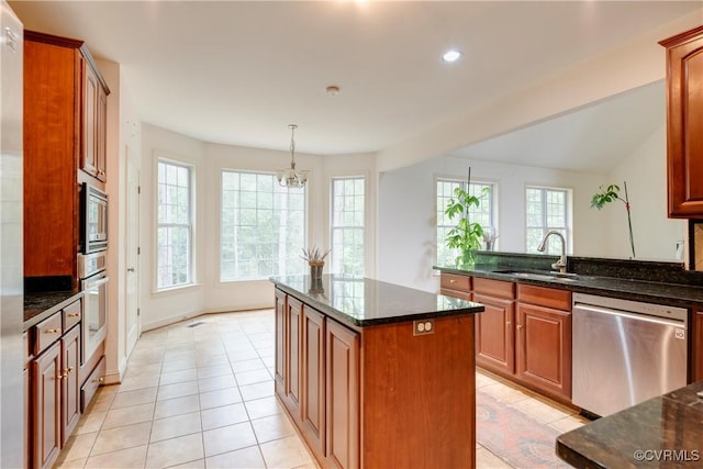 5470 Tyshire Pkwy, Providence Forge, VA 23140 - kitchen with a sink, appliances with stainless steel finishes, a chandelier, dark stone countertops, and light tile patterned floors