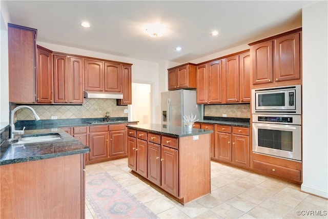 5470 Tyshire Pkwy, Providence Forge, VA 23140 - kitchen featuring appliances with stainless steel finishes, a sink, tasteful backsplash, dark stone countertops, and recessed lighting