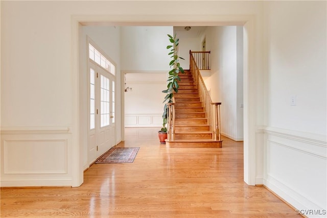 5470 Tyshire Pkwy, Providence Forge, VA 23140 - entryway with a decorative wall, stairway, light wood-style floors, and wainscoting