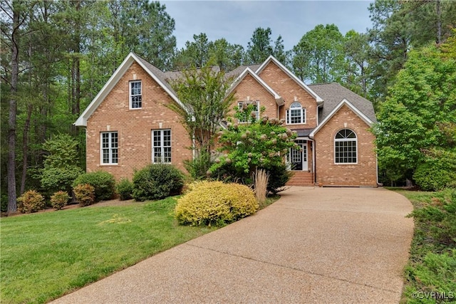 5470 Tyshire Pkwy, Providence Forge, VA 23140 - traditional home featuring brick siding, a front lawn, and a shingled roof