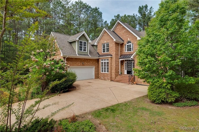 5470 Tyshire Pkwy, Providence Forge, VA 23140 - traditional-style home with brick siding, concrete driveway, a shingled roof, and an attached garage