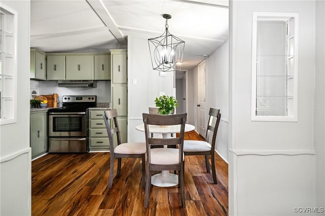 dining room featuring dark wood finished floors and a chandelier