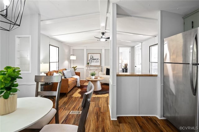 dining room with dark wood-type flooring and a ceiling fan