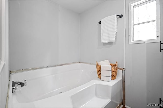 bathroom featuring a garden tub