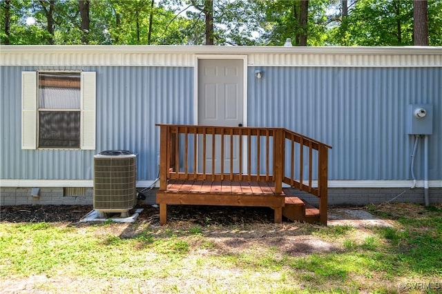 property entrance with central AC, crawl space, and a deck