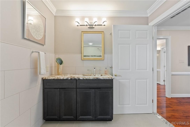 17475 Millfield Ln, Hanover, VA 23192 - bathroom with vanity, tile walls, crown molding, and a wainscoted wall