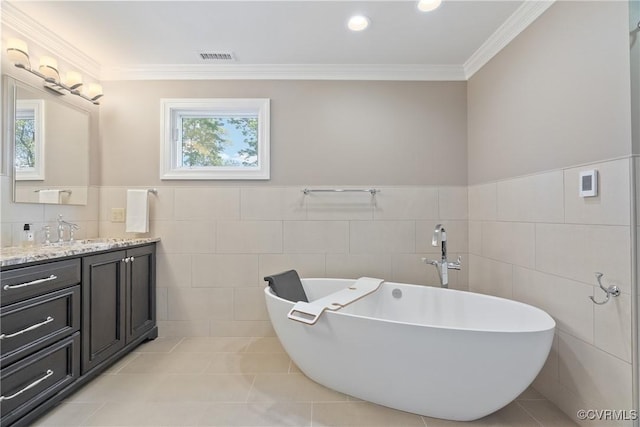 17475 Millfield Ln, Hanover, VA 23192 - full bath with tile walls, vanity, a freestanding tub, crown molding, and tile patterned floors