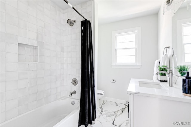 full bath with marble finish floors, toilet, shower / bath combination with curtain, baseboards, and vanity
