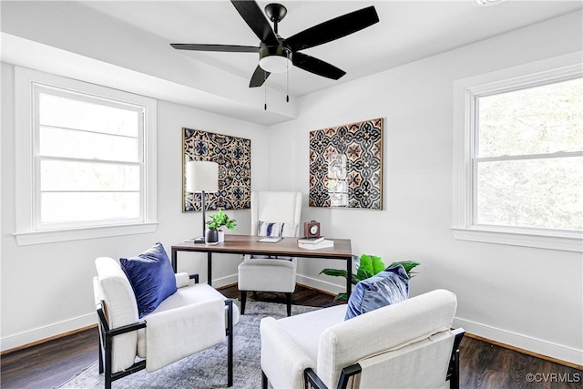 office with baseboards, plenty of natural light, wood finished floors, and a ceiling fan