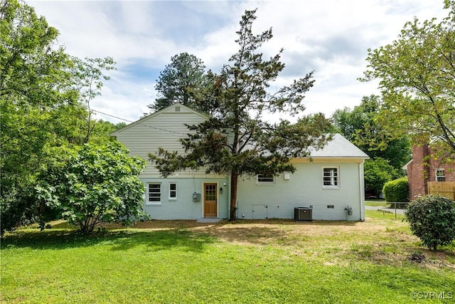 back of house featuring central AC unit