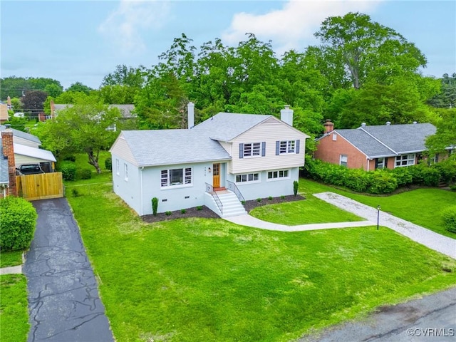 7910 San Juan Rd, Henrico, VA 23229 - tri-level home featuring a front lawn and a chimney