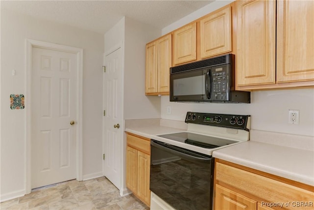kitchen with range with electric cooktop, black microwave, light brown cabinets, light countertops, and baseboards