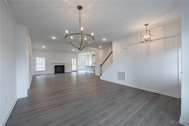 8264 Mount Eagle Rd, Hanover, VA 23005 - unfurnished living room with a chandelier, baseboards, dark wood-type flooring, stairway, and ornamental molding