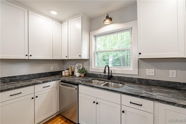 6101 Lewis Rd, North Dinwiddie, VA 23803 - kitchen featuring dishwasher, a sink, white cabinetry, dark stone countertops, and light wood-style floors