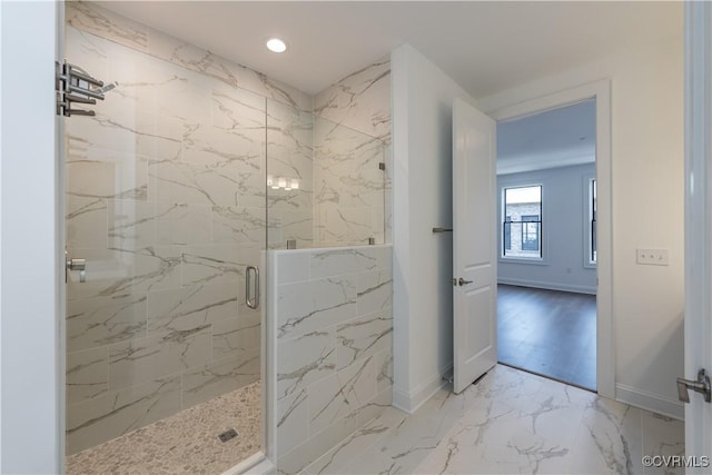 full bathroom featuring a marble finish shower, marble finish flooring, recessed lighting, and baseboards