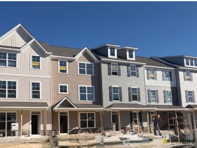 townhome / multi-family property featuring board and batten siding