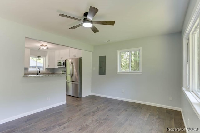 917 Chapel Neck Rd, North, VA 23128 - unfurnished room with electric panel, a ceiling fan, dark wood finished floors, a sink, and baseboards