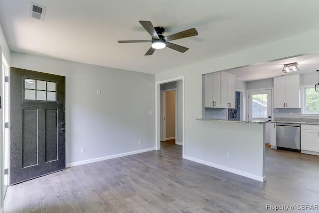 917 Chapel Neck Rd, North, VA 23128 - unfurnished living room with ceiling fan, wood finished floors, and baseboards