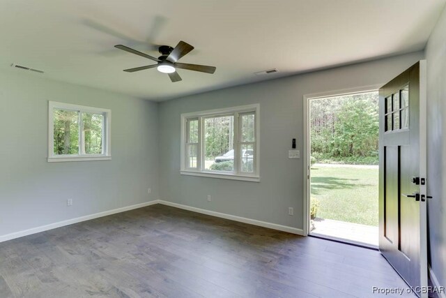 917 Chapel Neck Rd, North, VA 23128 - unfurnished room with healthy amount of natural light, a ceiling fan, baseboards, and wood finished floors