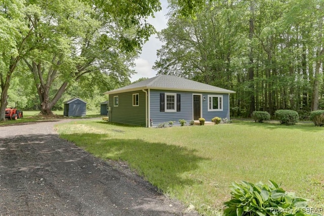 917 Chapel Neck Rd, North, VA 23128 - view of front of property with an outdoor structure, a front yard, a shed, and gravel driveway