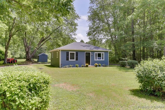 917 Chapel Neck Rd, North, VA 23128 - view of front of property featuring a front lawn, an outbuilding, and a storage shed