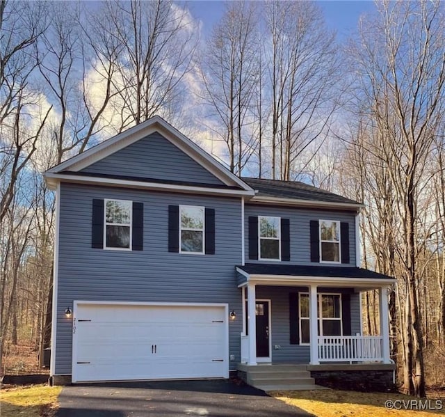 409 Confederate Dr, Orange, VA 22508 - view of front of property featuring covered porch, an attached garage, and asphalt driveway