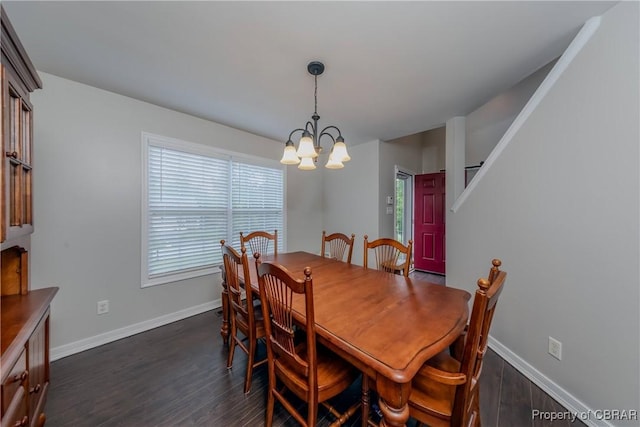 5631 Buckhunt Ln, New Kent, VA 23124 - dining space with a chandelier, dark wood-type flooring, and baseboards