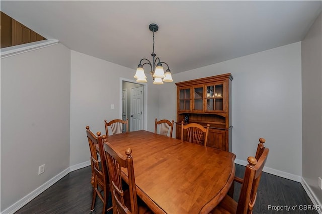 5631 Buckhunt Ln, New Kent, VA 23124 - dining room featuring a chandelier, dark wood-style flooring, and baseboards