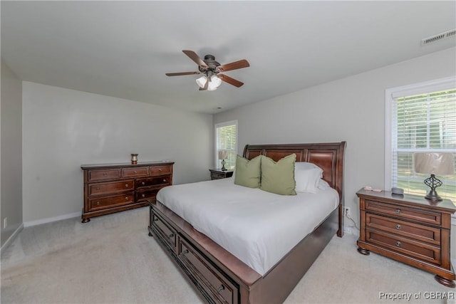 5631 Buckhunt Ln, New Kent, VA 23124 - bedroom featuring light colored carpet, multiple windows, baseboards, and ceiling fan