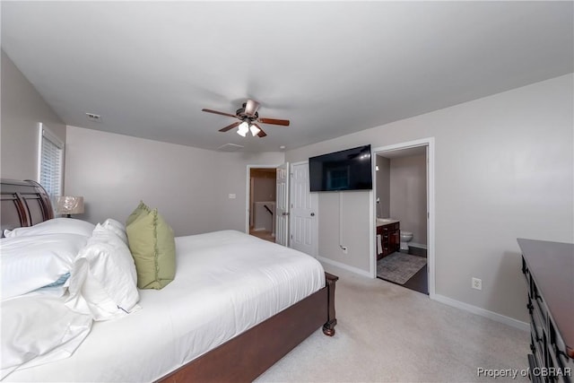 5631 Buckhunt Ln, New Kent, VA 23124 - bedroom featuring light colored carpet, baseboards, connected bathroom, ceiling fan, and a closet