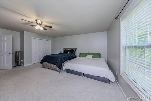 5631 Buckhunt Ln, New Kent, VA 23124 - bedroom with light colored carpet, baseboards, a ceiling fan, and a closet