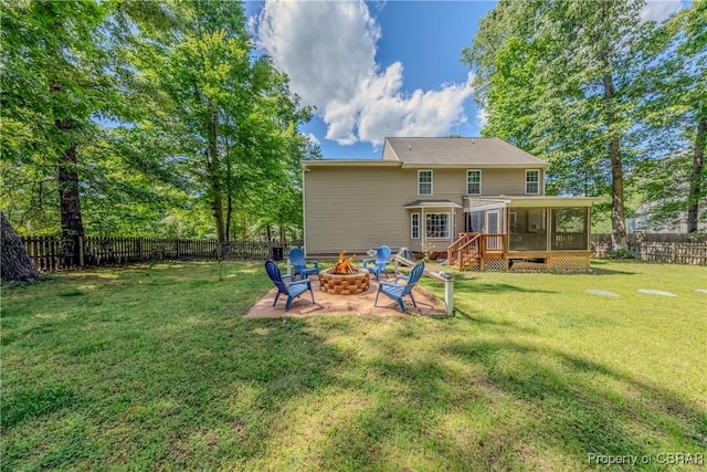 5631 Buckhunt Ln, New Kent, VA 23124 - rear view of property with an outdoor fire pit and a sunroom